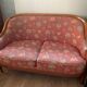 Art Deco style sofa, covered in Indian fabric with a pink background