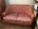 Art Deco style sofa, covered in Indian fabric with a pink background