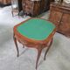 Half-moon gaming table in Louis XV style, made of precious wood marquetry.
