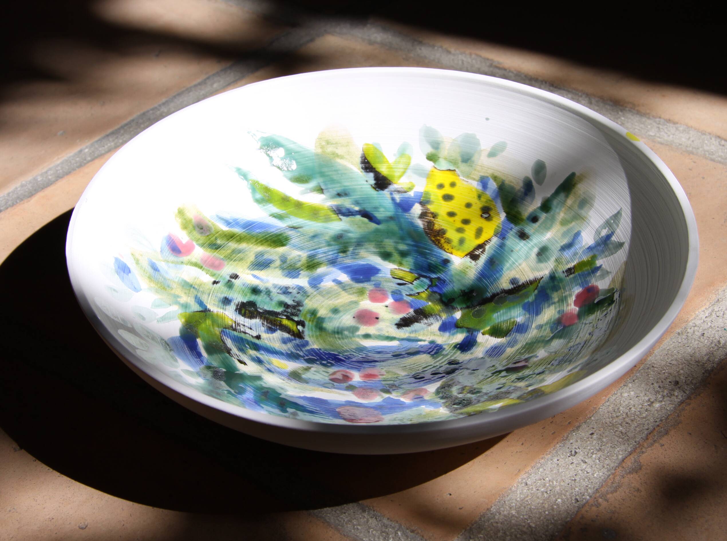 Decorated white earthenware fruit bowl
