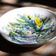 Decorated white earthenware fruit bowl