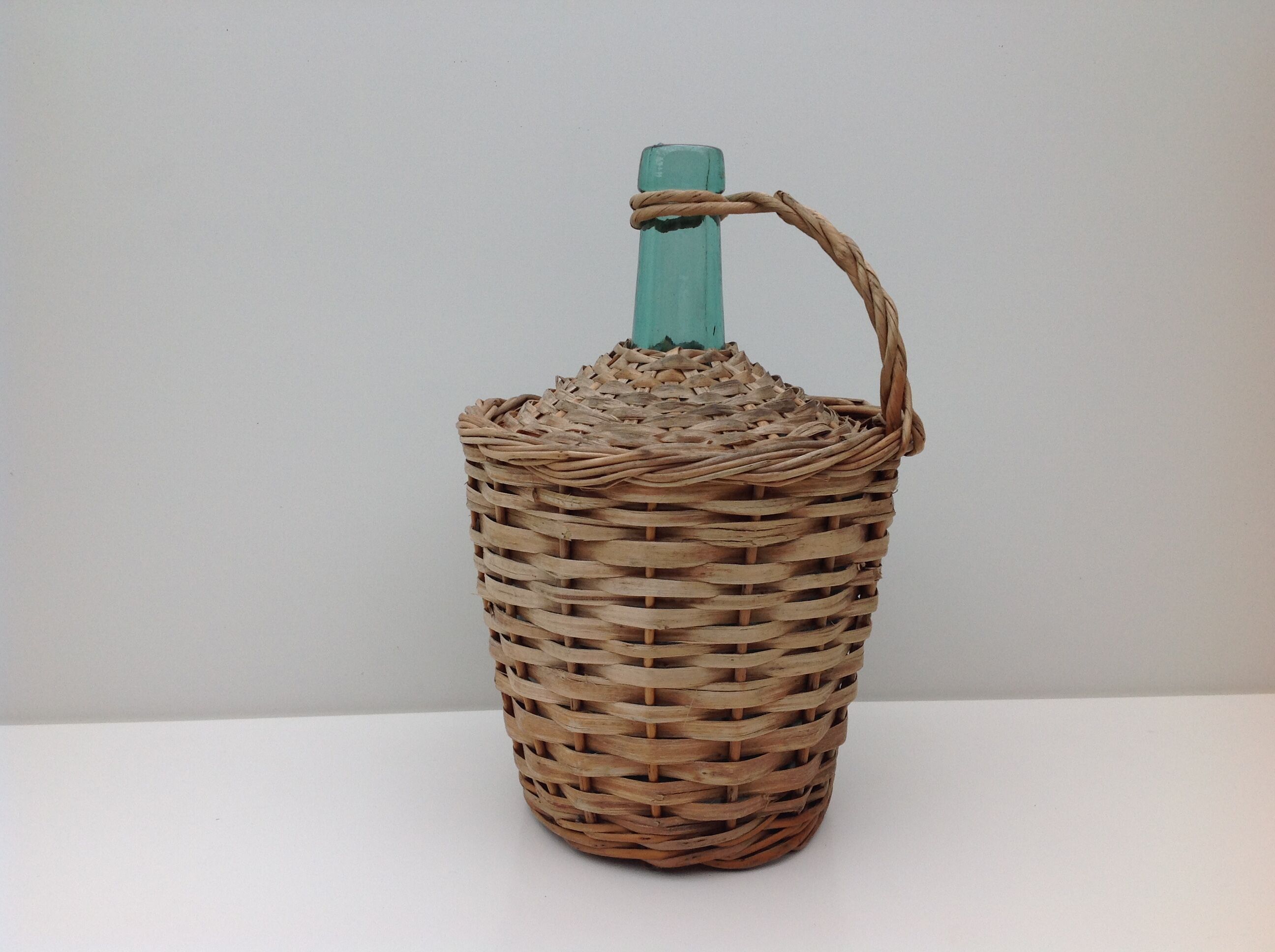 Demojohn surrounded by wicker