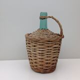 Demojohn surrounded by wicker