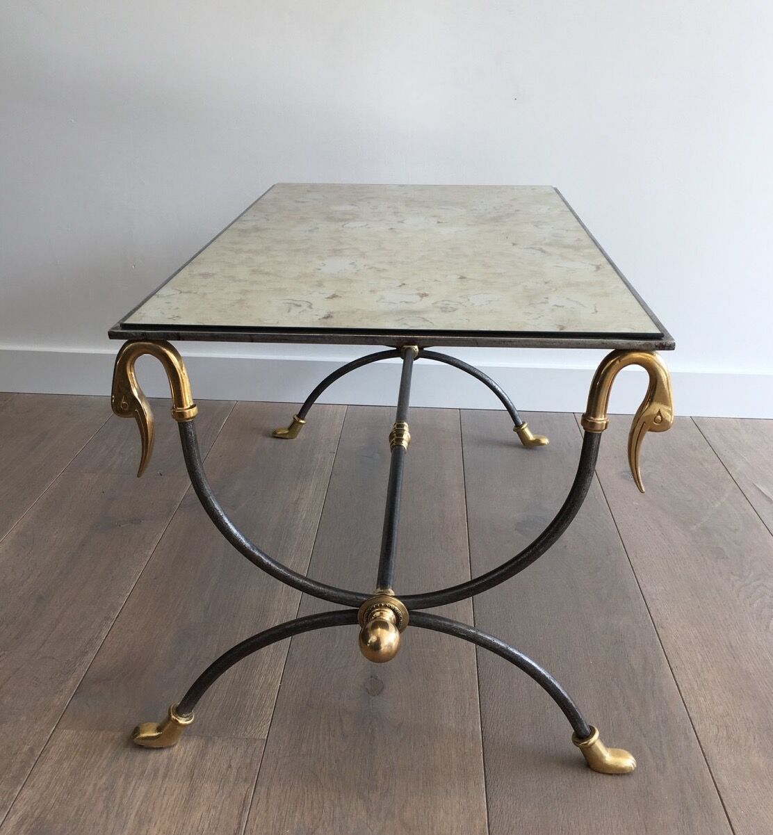 Coffee table in brushed steel and brass