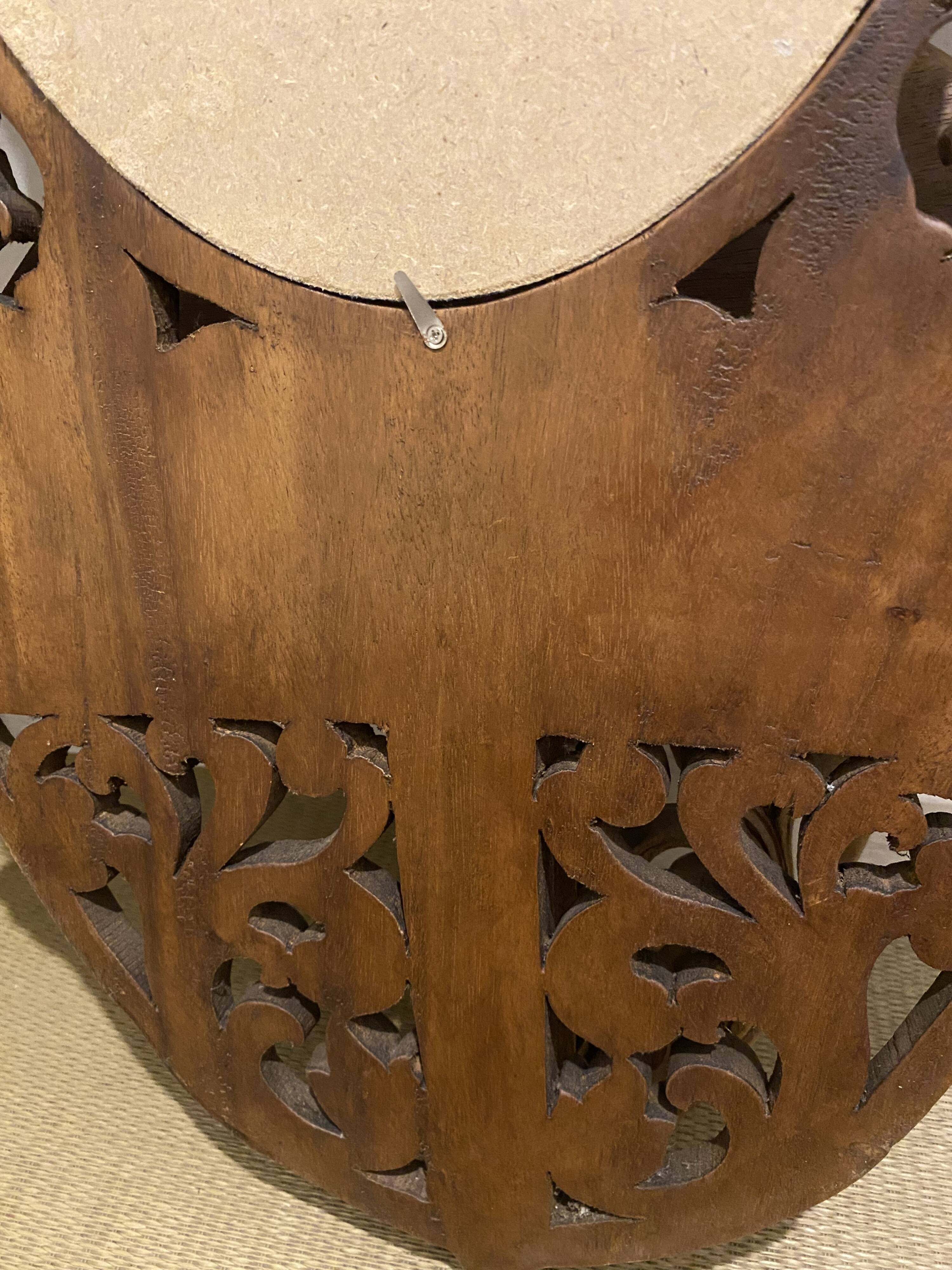 Carved mirror with integrated shelf