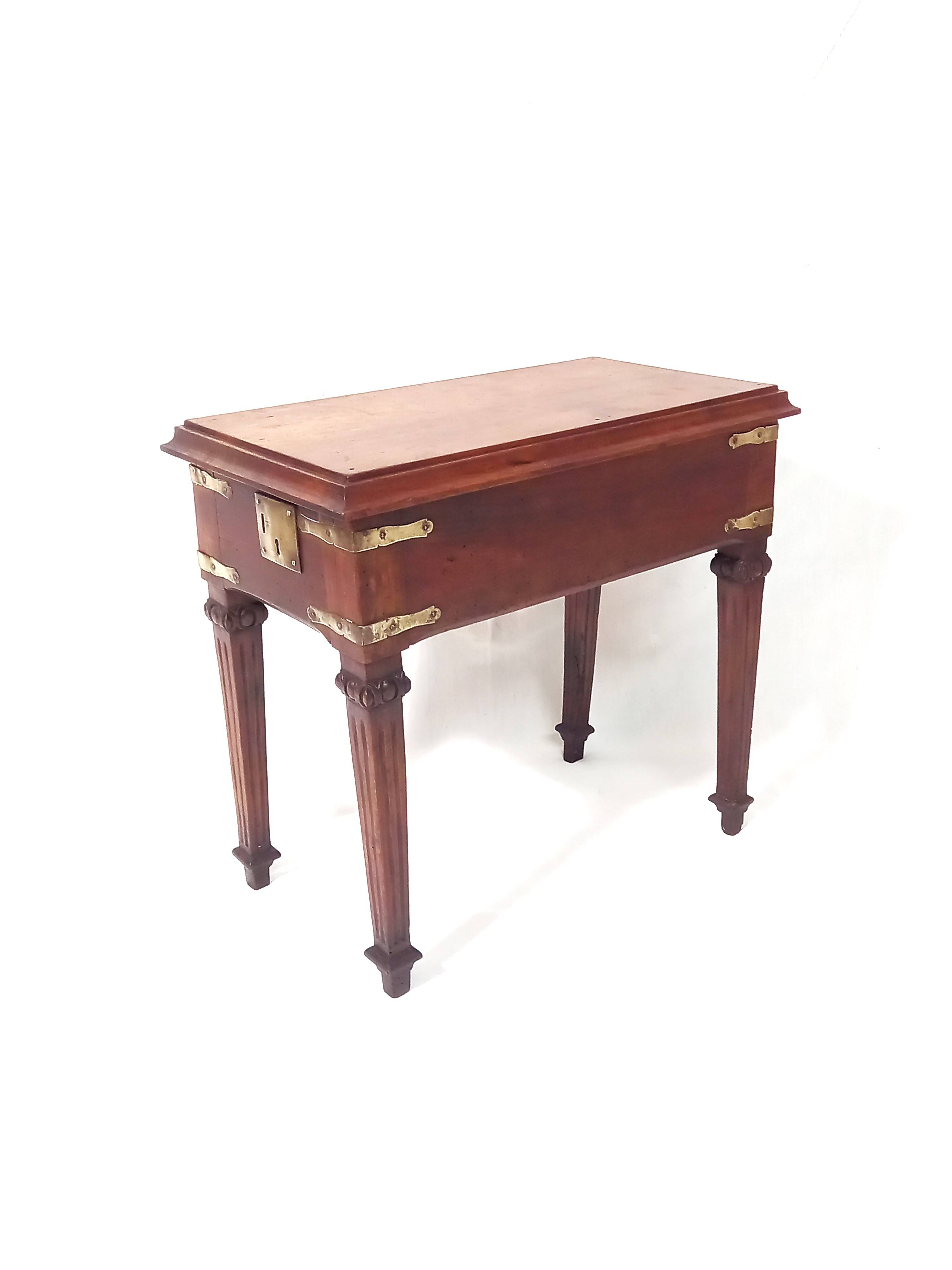 Small old side table with brass finishes