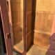Asymmetrical vintage wardrobe painted in terracotta.
