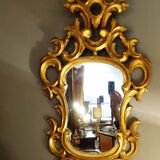 Carved and gilded wooden mirror with gold leaf 46 x 103 cm