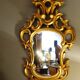 Carved and gilded wooden mirror with gold leaf 46 x 103 cm