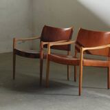 Pair of vintage Per-Olof Scotte "Premier 69" oak armchairs in cognac leather