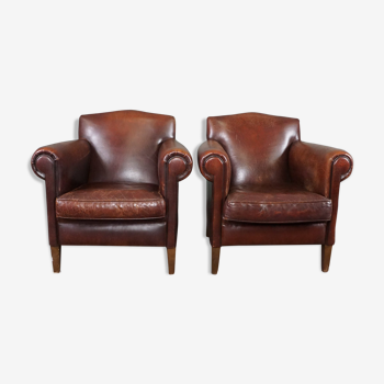 Ensemble de deux fauteuils en cuir de mouton