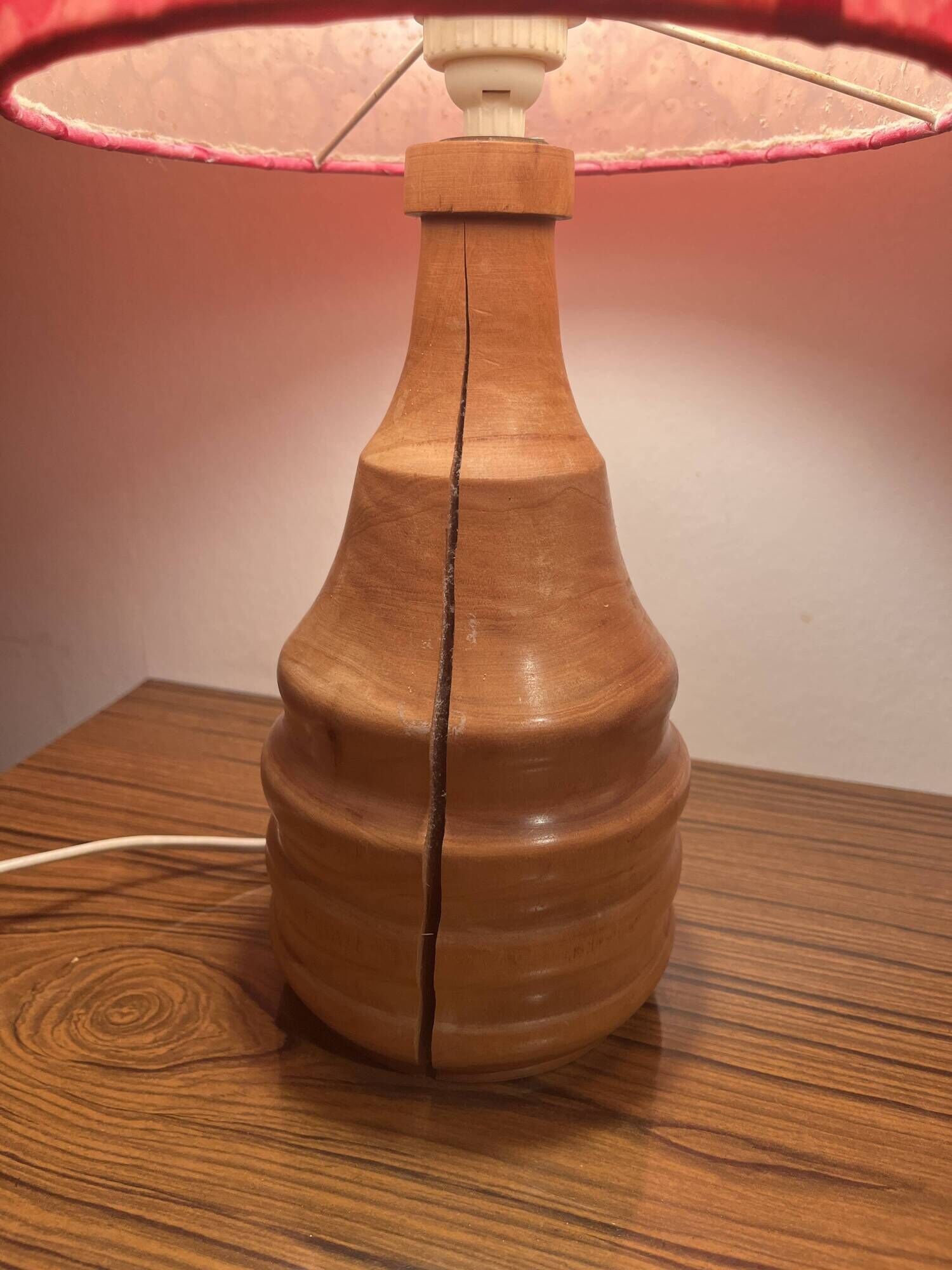 Vintage lamp with a carved wooden base from the 1970s.
