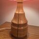 Vintage lamp with a carved wooden base from the 1970s.