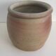 Ancient sandstone pot at one handle