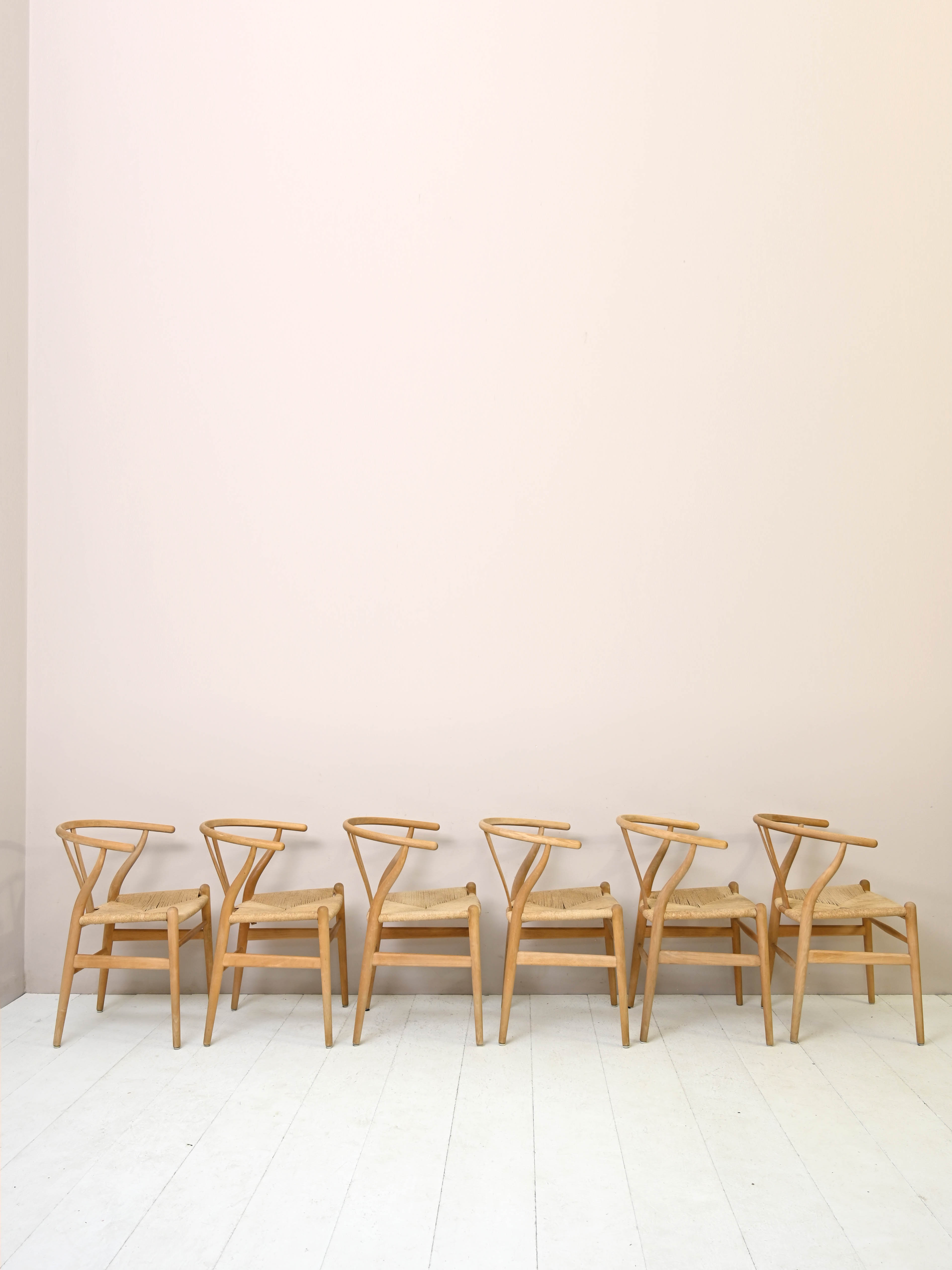 Set of six 'Wishbone chair' model chairs by Hans J. Wegner with leather cushions