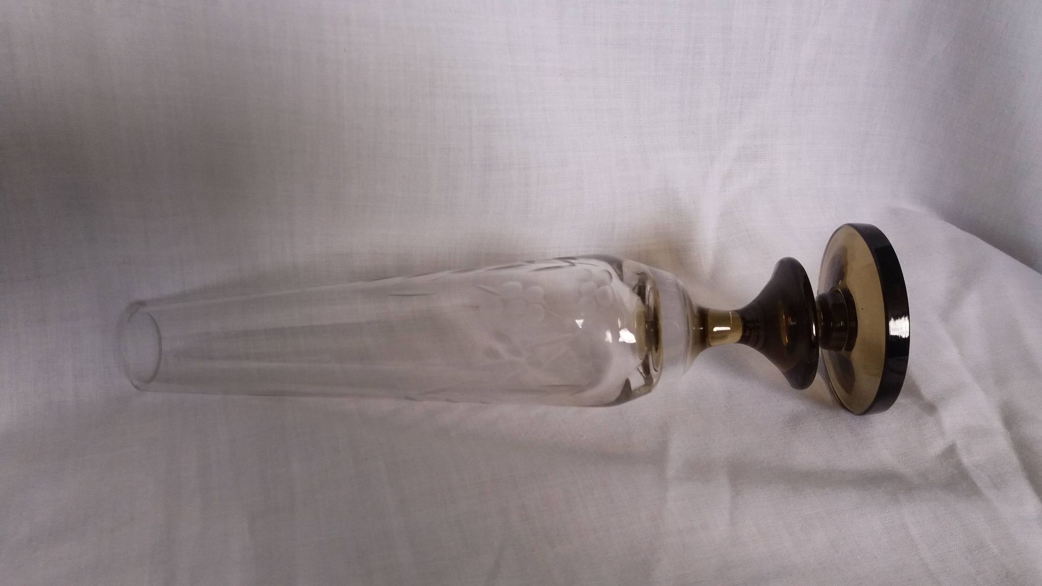 Cut glass soliflore vase with a smoked glass base.