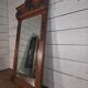 Bevelled mirror in carved wood