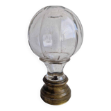 Glass and brass stair ball