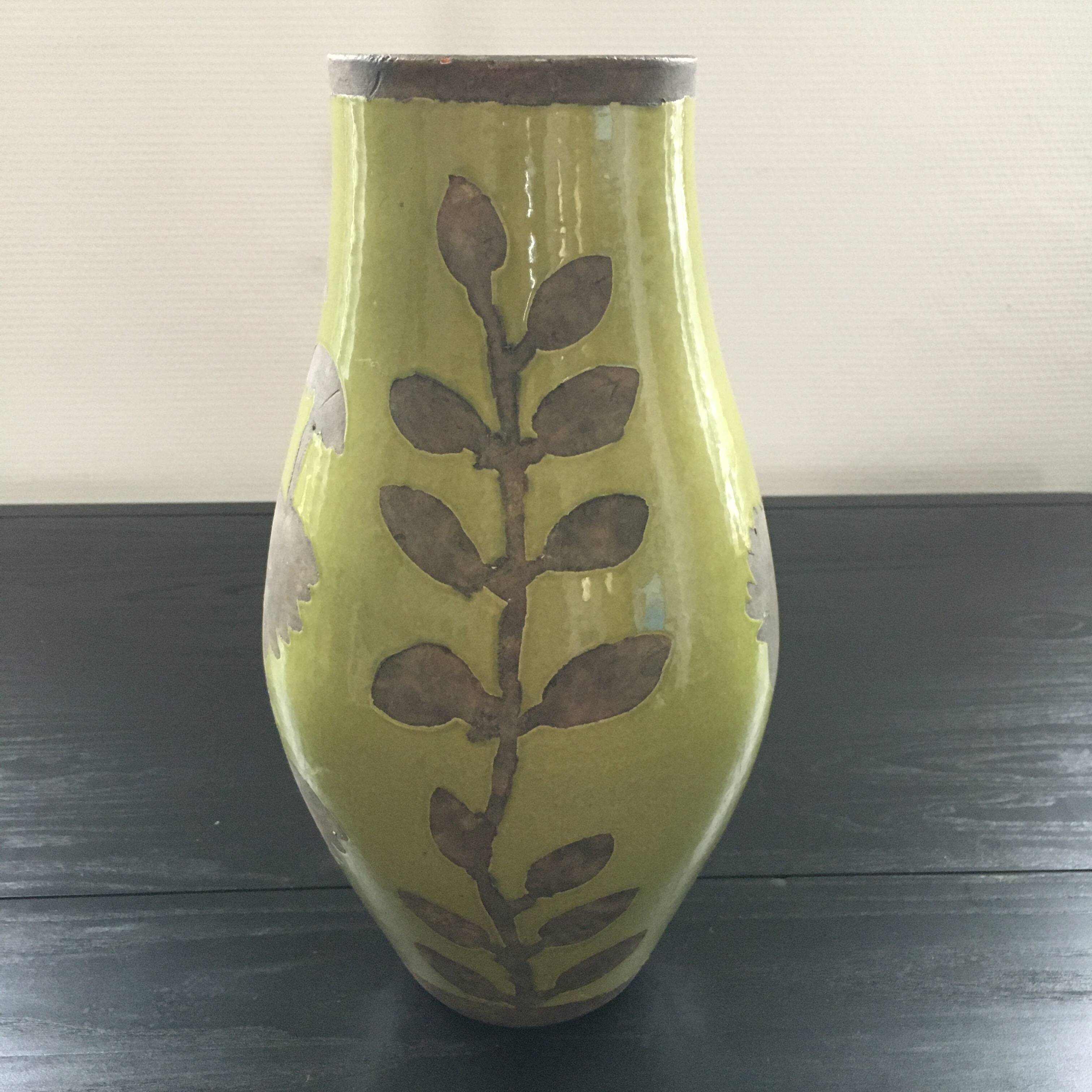 Large green vase with floral decoration