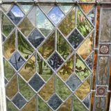 Pair of old double stained glass doors. Metal frames. Stained glass windows