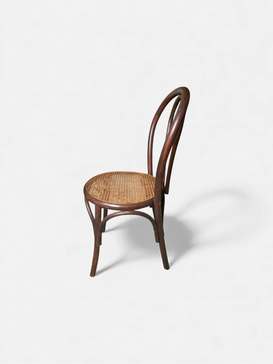 Vintage bistro chair in bent beech, caned seat – Thonet spirit