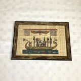 Egyptian papyrus under glass in wooden frame