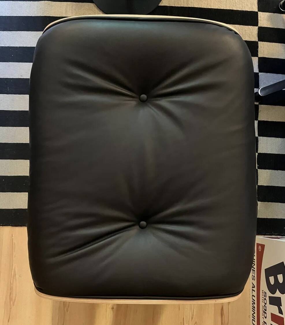 Lounge chair and ottoman by Charles Eames