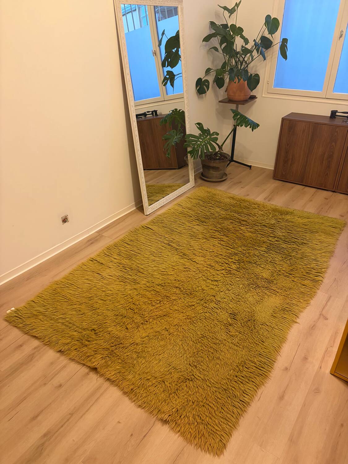 Large handmade wool rug from the 70s in lime green.