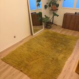 Large handmade wool rug from the 70s in lime green.