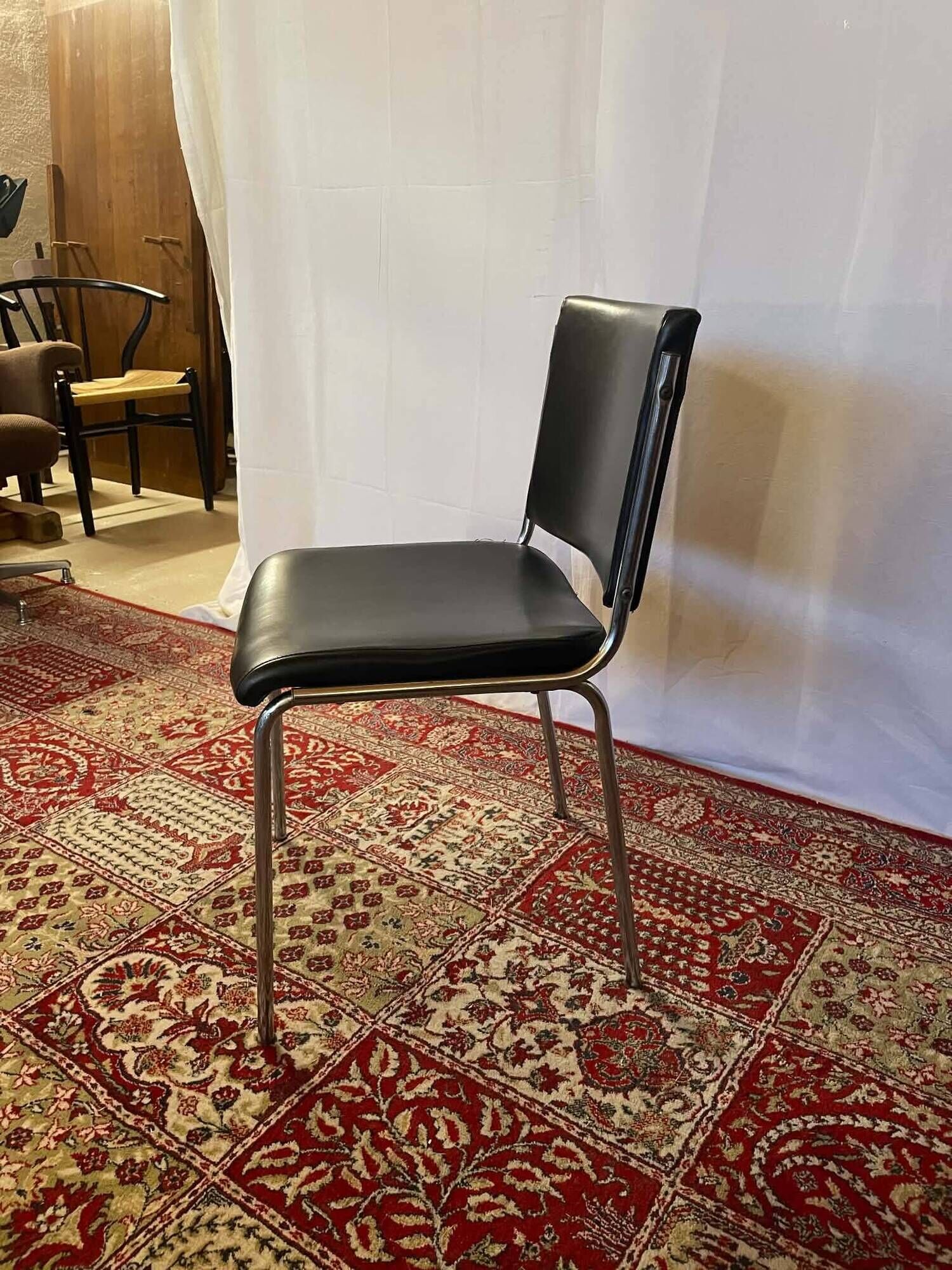 Vintage chair in black faux leather and chrome metal