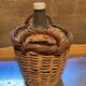 Dame-jeanne in 10L glass and wicker basket, old