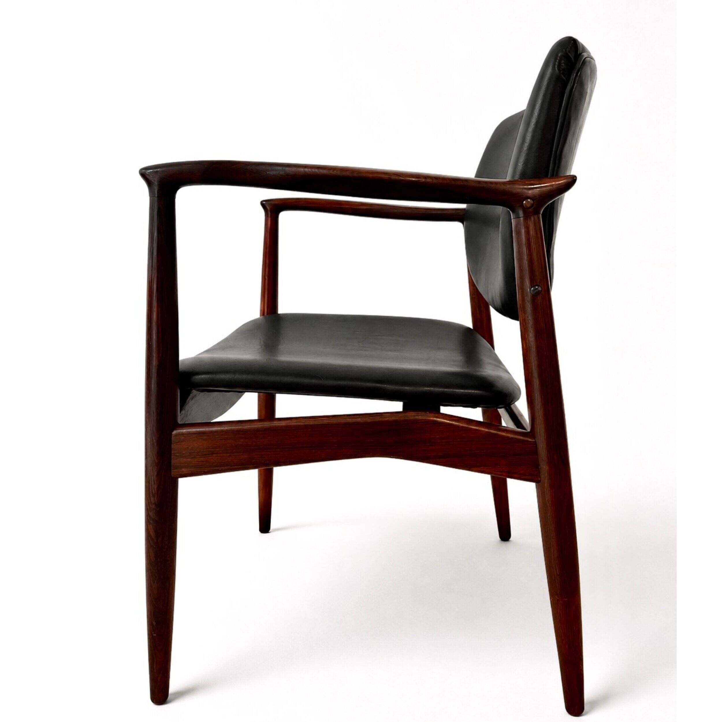 Captain armchair in rosewood by Erik Buch
