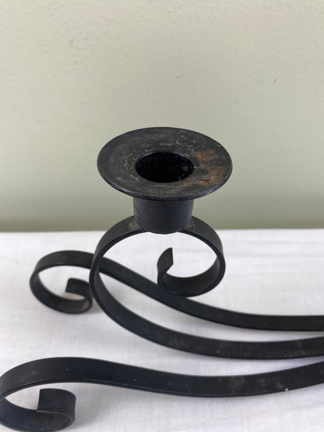 Pair of wrought iron candlesticks