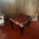 Red leather footrest in Chesterfield style, vintage 1970s.