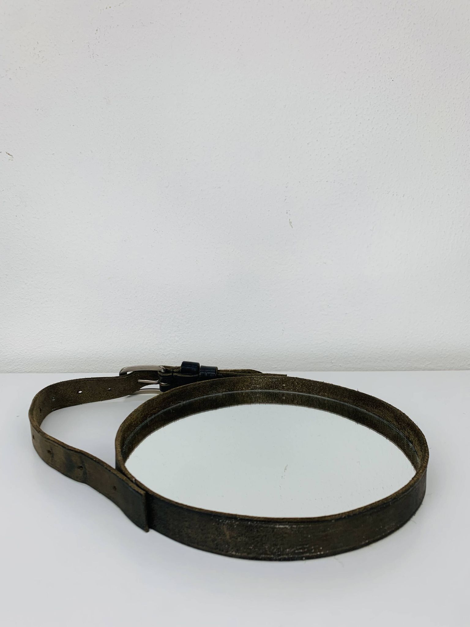Mirror with handmade leather strapping