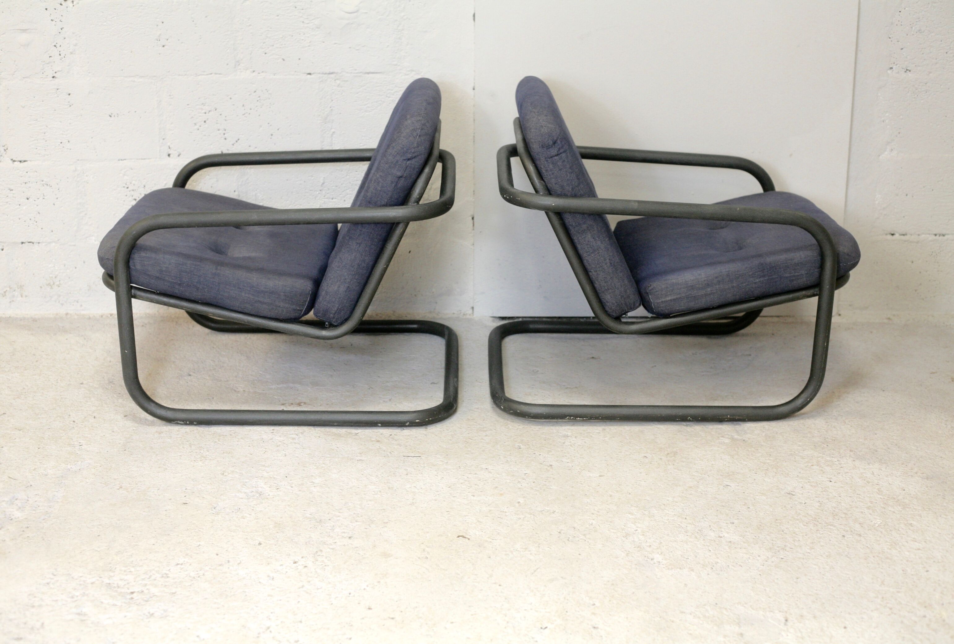 Pair of Prisunic edition armchairs, tubular steel and foam cushions, France, 1973