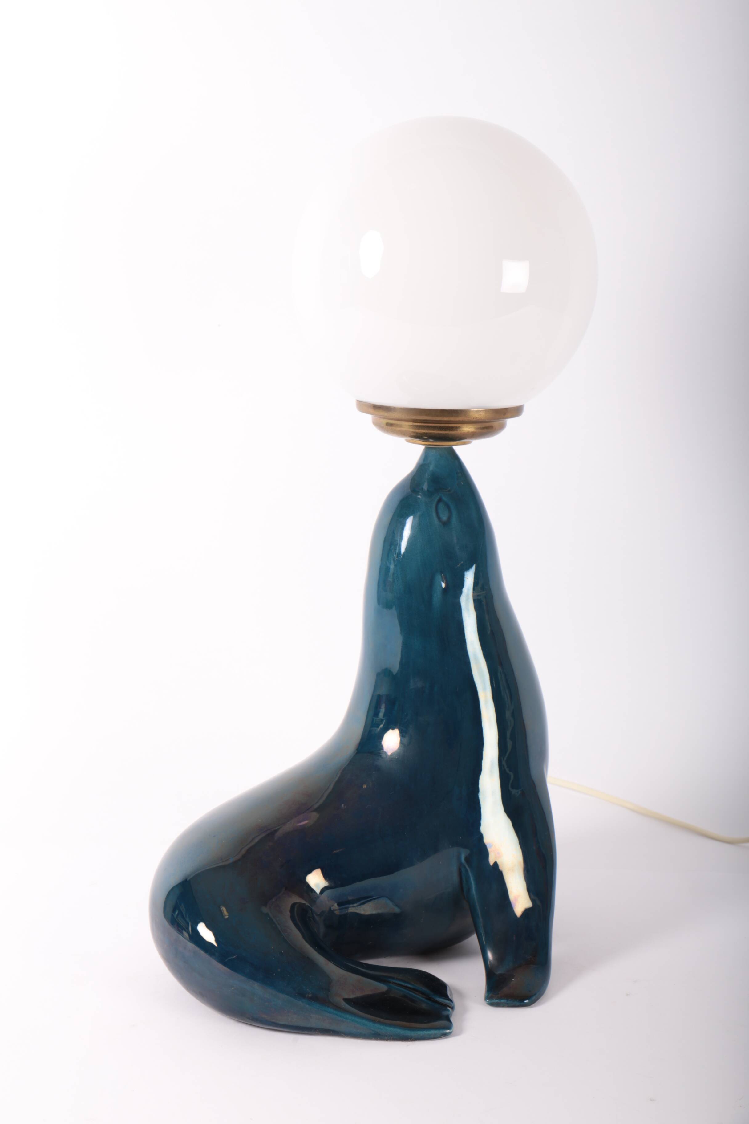 Blue ceramic sea lion lamp