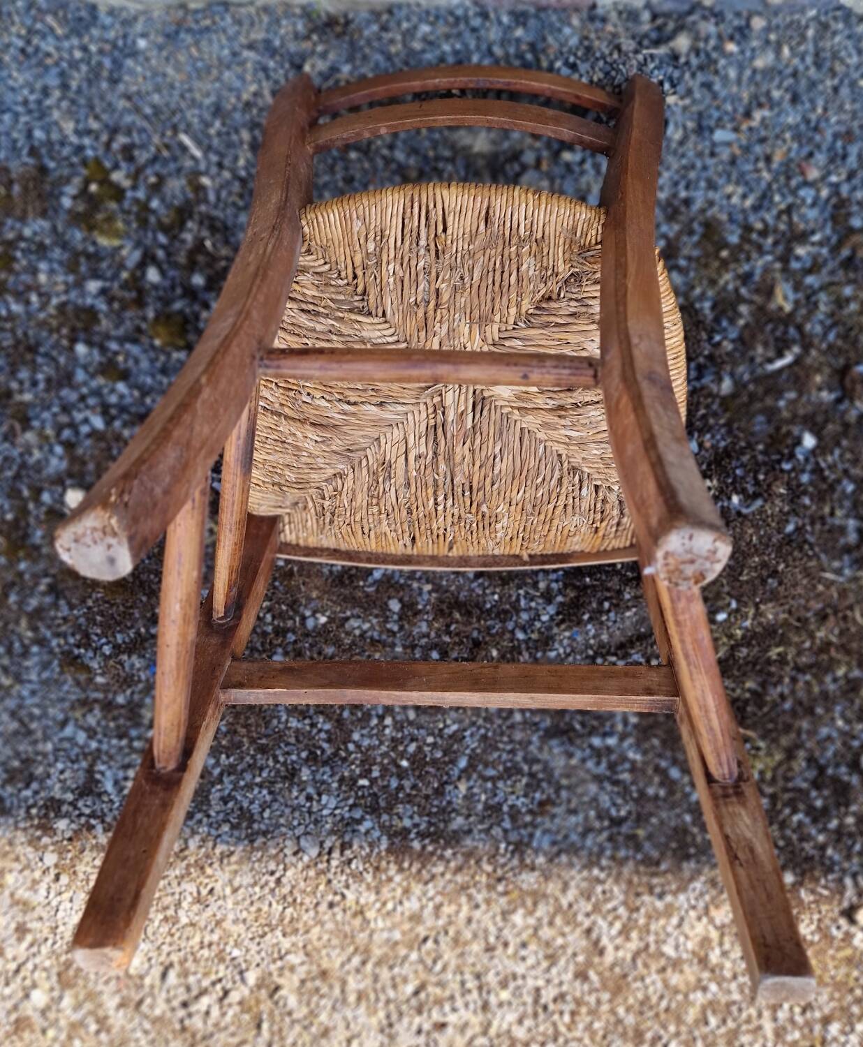 Antique straw chair with low back