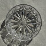 Circular glass ashtray with stylized petal patterns