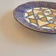 Decorative plate in glazed earthenware HB Quimper with ethnic patterns.