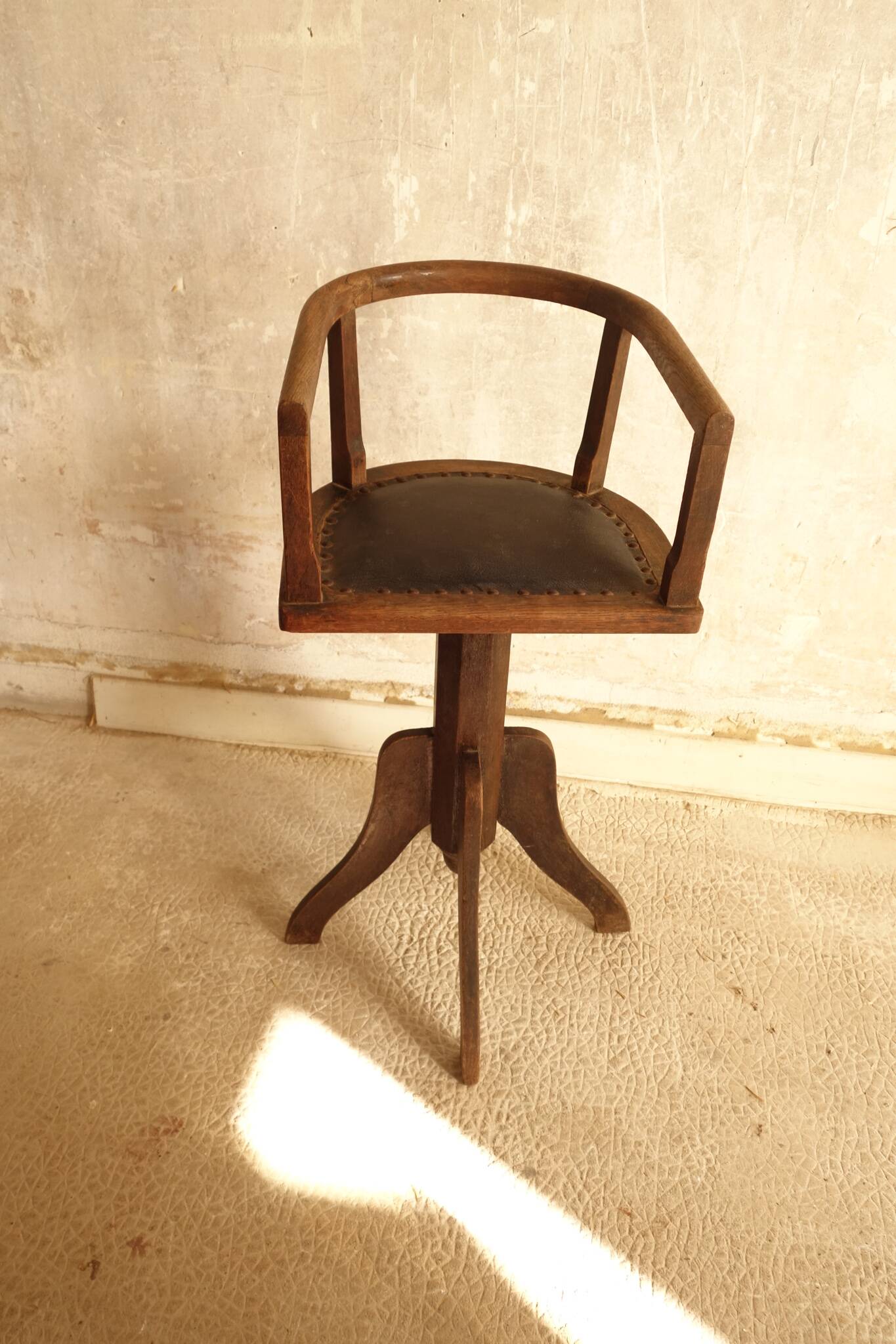 Antique wooden swivel chair
