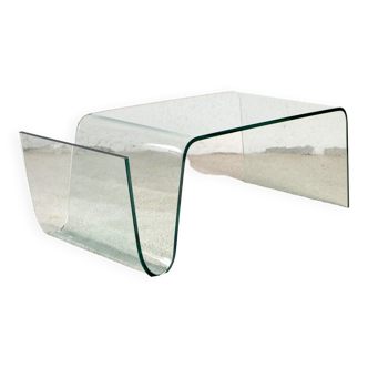 Curved glass coffee table with magazine rack