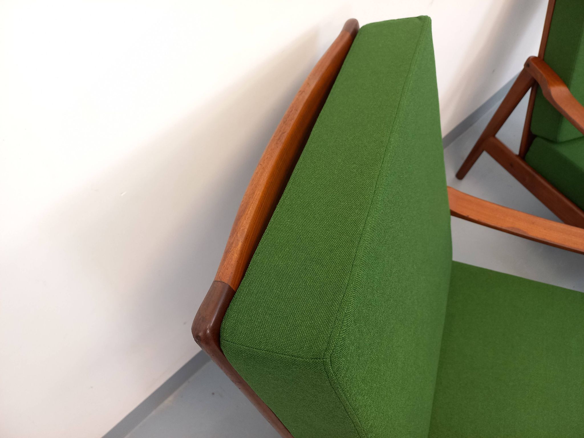 Pair of vintage Scandinavian armchairs in teak and green fabric from the 1960s.