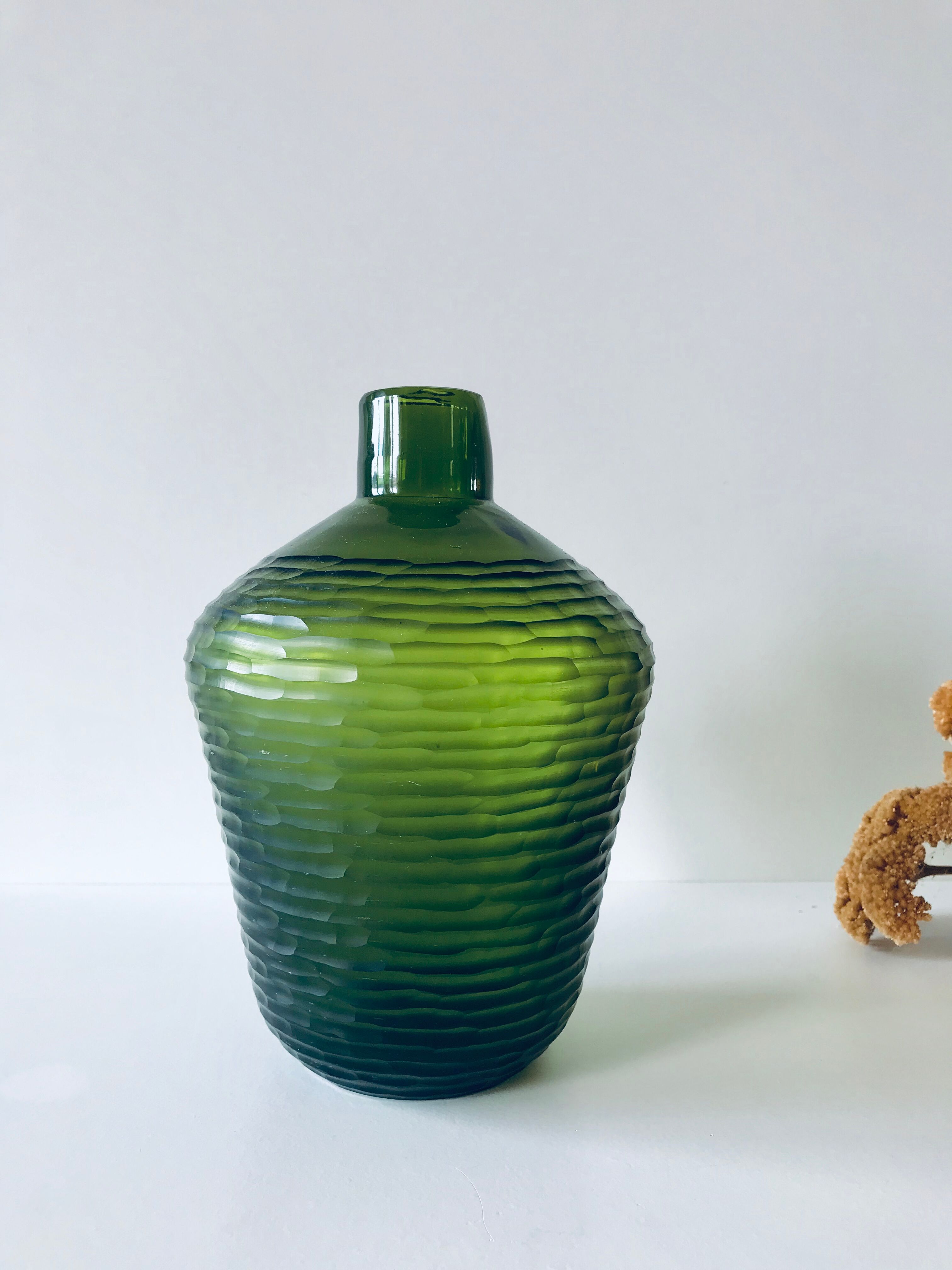 Green carved glass vase