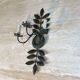 Pair of decorative wall sconces with sunflowers and patinated metal foliage.