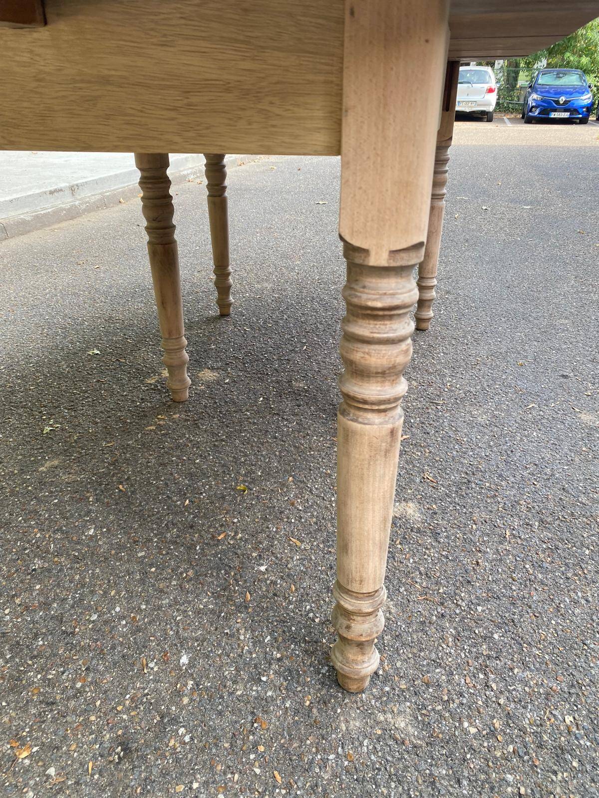 Round extendable dining table with flaps, stripped in raw oak, with 3 extensions.