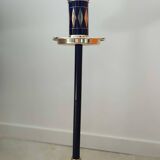 Vintage floor ashtray with a gold and black metal cigarette dispenser.