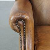 Sheep leather wingback chair with patina