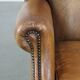 Sheep leather wingback chair with patina
