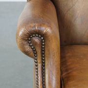 Patinated sheep leather wingback armchair